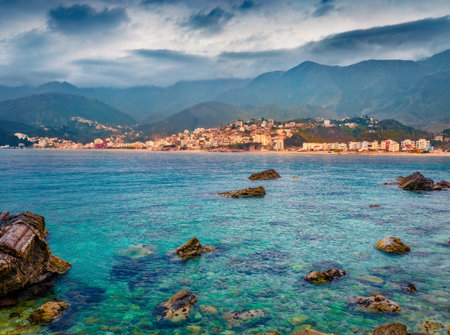 Gloomy morning view of Potam Public beach. Scenic morning seascape of the Adriatic sea. Spectacular cityscape of Himare town, Albania, Europe. Travel concept background.の写真素材