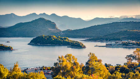 Calm spring view of Ksamil town. Aerial morning seascape if Ionian sea. Stunning outdoor scene of Butrint National Park, Albania, Europe. Travel concept background.の写真素材
