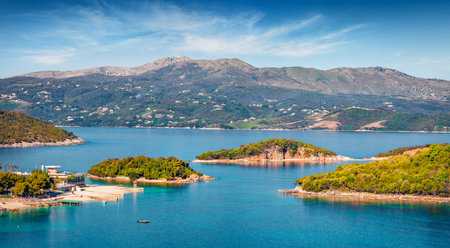 Aerial seascape of Ionian sea with Corfu island on background. Colorful spring view of Ksamil village. Splendid outdoor scene of Albania, Europe. Travel concept background.の写真素材