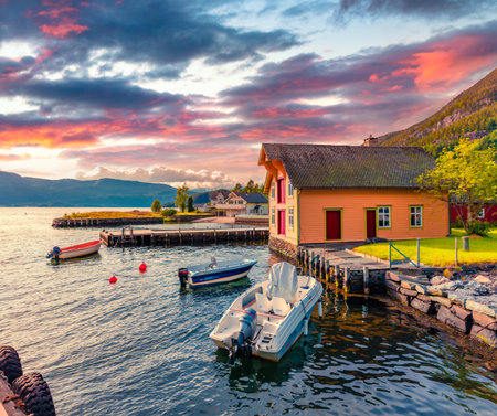 Beautiful Nordic scenery. Picturesque summer sunrise on typical Norwegian village - Jondal. Adorable morning scene of Norwegian fjord. Travel concept background.のeditorial素材