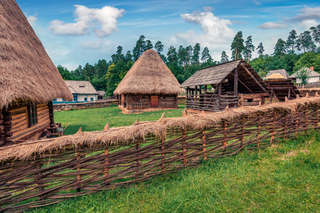 Exotic summer view of traditional romanian peasant houses. Captivating rural scene of Transylvania, Romania, Europe. Beauty of countryside concept background.のeditorial素材