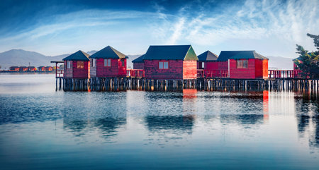 Spectacular morning view of fishing dock on popular tourist attraction Patocut Laguna. Impressive morning seascape of the Adriatic Sea, Albania, Europe. Travel concept background.のeditorial素材