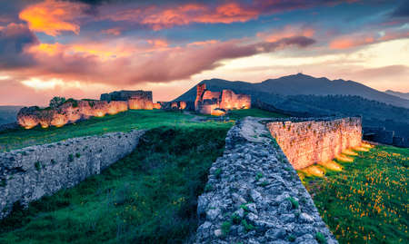 Unbelievabl sunset on ruins of Rozafa Castle. Spectacular evening scene of Shkoder city. Superb outdoor scene of Albania, Europe. Travel concept background.の写真素材