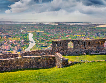 Splendid spring view of ruins of Lezhe Fortress. Sunny morning cityscape of Lezha town, Albania, Europe. Travel concept background.の写真素材