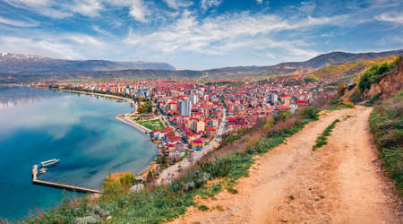Aerial spring cityscape of Pogradec town. Astonishing morning scene of Ohrid lake and old country road. Incredible landscape of Albania, Europe. Beauty of nature concept background.の写真素材