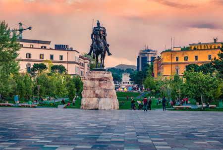 Tirana, Albania - April 29, 2021: Monument of Skanderbeg in Scanderbeg Square. Colorful spring sunset in the capital of Albania - Tirana.のeditorial素材