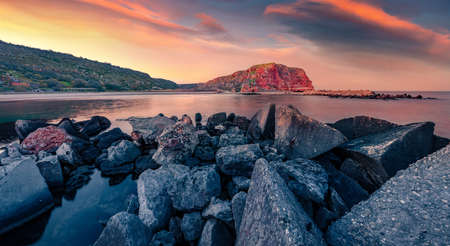 Red cliffs on the Bolata beach. Panoramic spring seascape of Black Sea. Sunrise in Bulgaria, Europe. Beauty of nature concept background.の写真素材