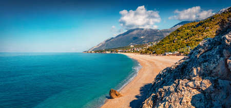 Panoramic spring view of public beach in Dhermi town. Colorful morning seascape of the Adriatic sea. Attractive spring scene of Albania, Europe. Travel concept background.の写真素材
