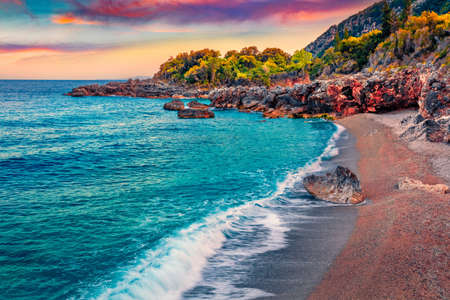 Fantastic sunrise on Apelistra beach, Himare location. Incredible spring morning in Albania, Europe. Majestic seascape of the Adriatic sea. Beauty of nature concept background.の写真素材