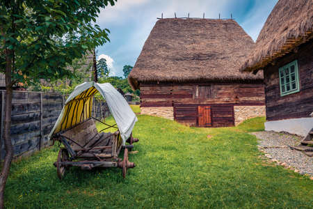 Wonderful summer view of traditional romanian peasant houses. Impressive rural scene of Transylvania, Romania, Europe. Beauty of countryside concept background.の写真素材
