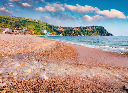 Exciting morning view of Himare town. Spectacular spring seascape of the Adriatic sea. Wonderful outdoor scene of Albania, Europe. Travel concept background.の写真素材