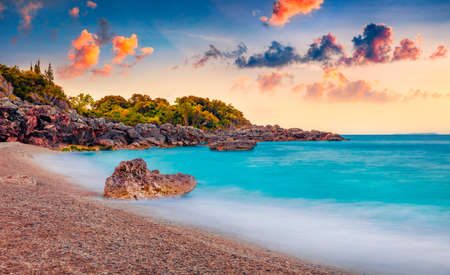 Fabulous sunrise on Apelistra beach, Himare location. Superb spring morning in Albania, Europe. Stunning seascape of the Adriatic sea. beauty of nature concept background.の写真素材