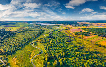 Aerial green view of Seret river. Amazing morning scene of Ternopil countryside, Ukraine, Europe. View from flying drone of green valley.の写真素材