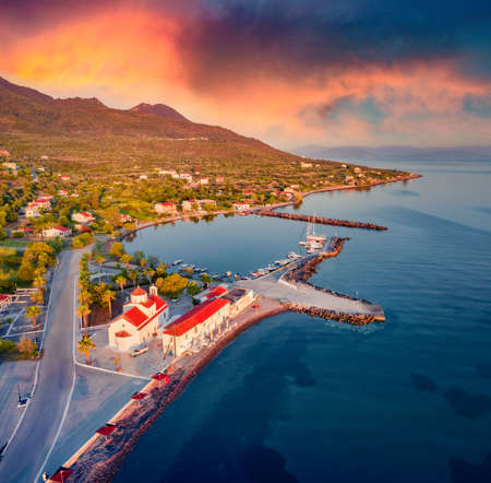 Dramatic summer sunrise in St. georgios port. Superb morning scene of Peloponnese peninsula, Greece, Europe. Spectacular seascape of Myrtoan Sea. Travel concept background.の写真素材