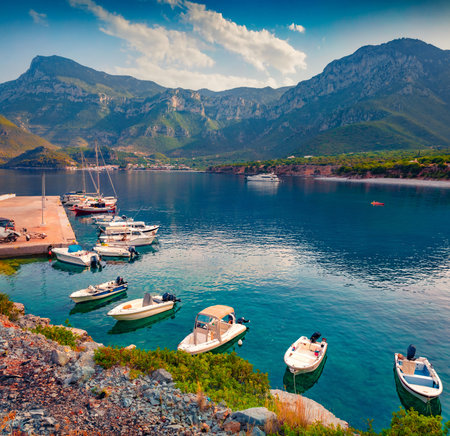 Wonderful summer view of Logari port with small fishing boat and Kyparissi village on background. Spectacular outdoor scene of Peloponnese peninsula, Greece, Europe. Calm morning seascape of Myrtoan Sea.の写真素材