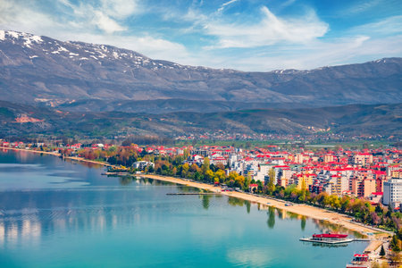 Incredible spring cityscape of Pogradec town. Wonderful outdoor scene of Ohrid lake. Spectacular morning view of Albania, Europe. Travel concept background.の写真素材