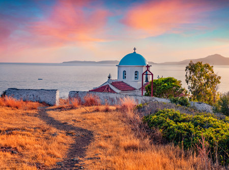 Picturesque summer view of Agia Paraskevi Church. Colorful sunset on Peloponnese peninsula, Greece, Europe. Stunning summer seascape of Ionian sea. Travel concept background.の写真素材
