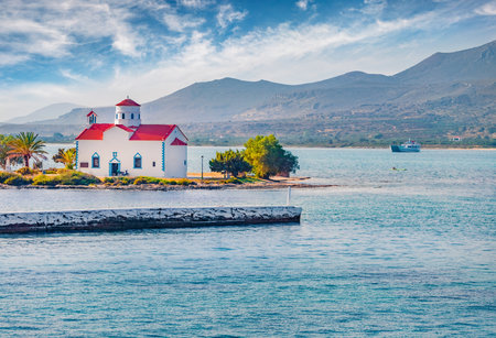 Impressive summer view of Saint Spiridon Greek Orthodox church. Beautiful outdoor scene of Elafonisos island, Greece. Bright Mrditerranean seascape. Travel concept background.の写真素材