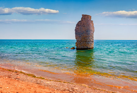 Empty Mylos Beach ruins of old Roman tower on background. Exotic summer scene of Peloponnese peninsula, Voria Kinouria, Greece, Europe. Adorable Myrtoanian seascape. beauty of nature concept background.の写真素材