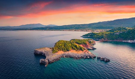 Stunning sunset on Saint Basil Beach with Agkali village on background, Nileas, Greece, Europe. Impressive summer scene of Euboea island. Astonishing morning seascape of Aegian sea.の写真素材