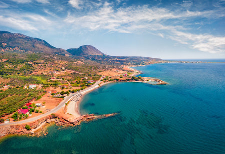 View from flying drone of Pyla beach, Demonia village location. Azure morning seascape of Mediterranean sea. Adorable summer landscape of Peloponnese peninsula, Greece, Europe.の写真素材