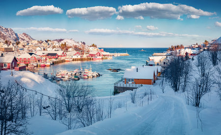 beautiful winter scenery. Sunny morning scene of Lofoten Islands. Amazing snowy cityscape of Sorvagen town, Norway, Europe. Splendid morning seascape of Norwegian sea.の写真素材