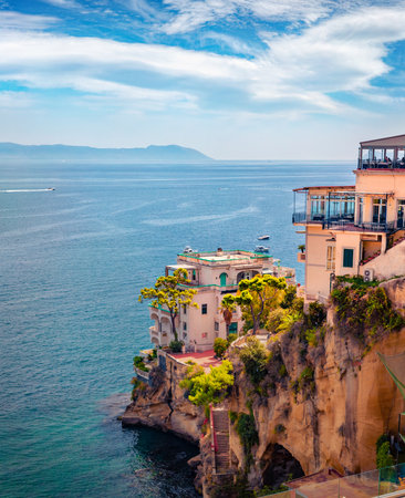 Old house on the edge of cliff. Impressive summer cityscape of Naples, Italy, Europe. Adorable seascape of Mediterranean seascape. Travel concept background.の写真素材