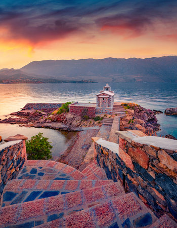 Photography of Peloponnese peninsula, Greece, Europe. Colorful evening view of Saint Spyridon Orthodox church, Kotronas village location. Beautiful mediterranean seascape.の写真素材