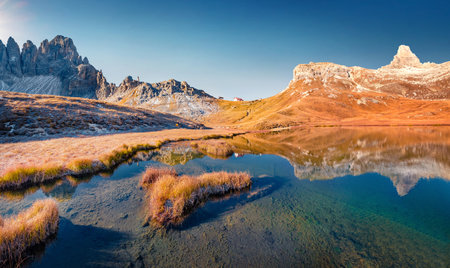 Paterno peak reflected in the Calm waters of Piani lake. Bright autumn view of Dolomite alps. Gorgeous morning scene of Tre Cime Di Laveredo National Park, Italy. Beauty of nature concept background.の写真素材