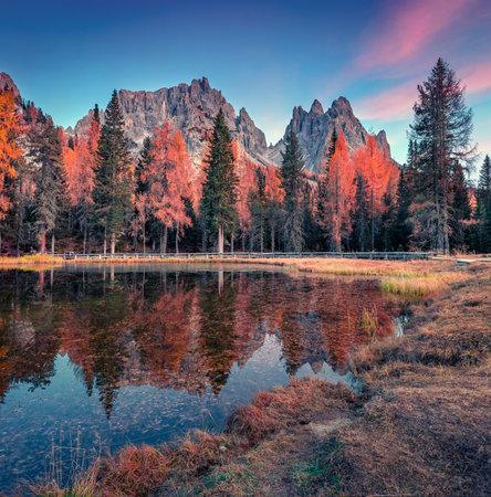 Exotic autumn sunrise in the Dolomite Alps. Spectacular evening view of Antorno lake. Majestic outdoor scene of Italy, Europe. Beauty of nature concept background.の写真素材