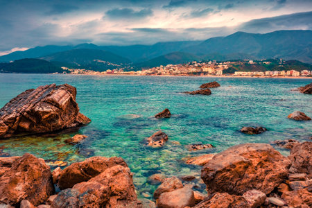 Incredible evening view of Potam Public beach. Gloomy morning seascape of the Adriatic sea. Beautiful cityscape of Himare town, Albania, Europe. Travel concept background.の写真素材