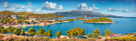 Panoramic seascape of Ionian sea with Corfu island on background. Wonderful spring view of Ksamil village. Spectacular outdoor scene of Albania, Europe. Travel concept background.の写真素材