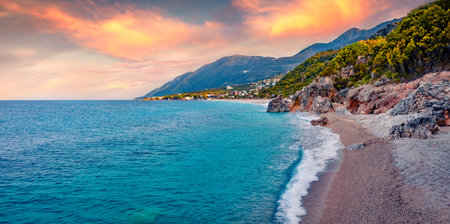 Incredible sunrise on Apelistra beach, Himare location. Spectacular spring morning in Albania, Europe. Wonderful seascape of the Adriatic sea. Beauty of nature concept background.の写真素材