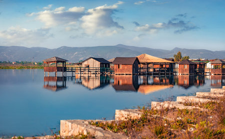 Captivating morning view of fishing dock on popular tourist attraction Patocut Laguna. Marvelous morning seascape of the Adriatic sea, Albania, Europe. Travel concept background.の写真素材
