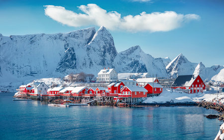 Attractive morning scene of Sakrisoy village, Norway, Europe. Bright winter view of Lofoten Islads witj typical red wooden houses. Beautiful seascape of Norwegian sea. Travel concept background.の写真素材