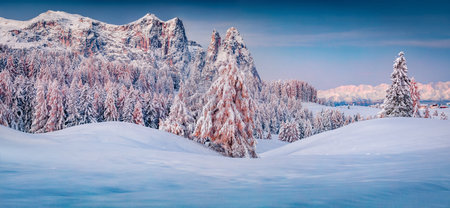 Panoramic morning view of Alpe di Siusi village. Colorful winter sunrise in the Dolomite Alps. Unbelievable landscape of Italian ski resort. Beauty of nature concept background.の写真素材