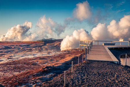Unbelievable summer scene of popular tourist destination where huge vapors rising from deep below, Geo Thermal Hot Springs - Gunnuhver. Spectacular evening scene of Iceland, Europe.の写真素材