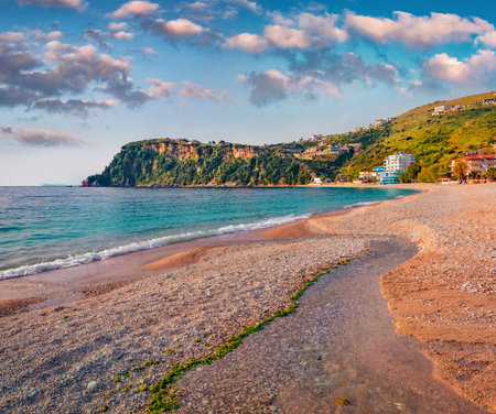 Sunny morning view of Himare town. Marvelous sumer seascape of the Adriatic sea with small creek. Beautiful outdoor scene of Albania, Europe. Travel concept background.の写真素材