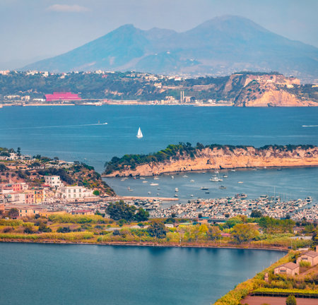 Superb morning cityscape of Miseno town on long focus. Stunning summer seascape of Mediterranean seascape. Impressive outdoor scene of Italy, Europe. Travel concept background.の写真素材
