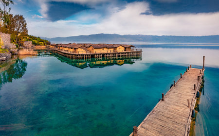 Calm morning scene of popular tourist destination - Bay of Bones. Stunning spring view of Ohrid lake. Attractive landscape of North Macedonia, Europe. Travel concept background.の写真素材