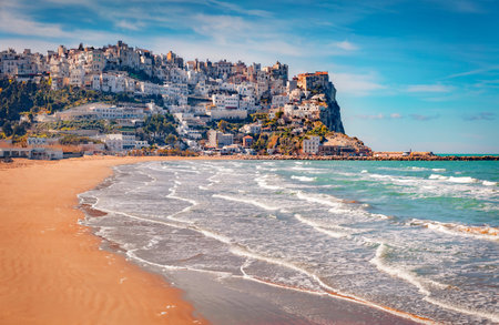 beautiful marine scenery. Amazing summer view of Peschici public beach, Province of Foggia, Italy, Europe. Exciting morning scene of the Adriatic sea. Travel concept background.の写真素材