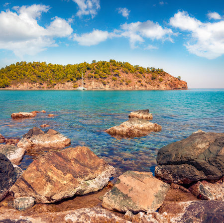 Sunny Mediterranean seascape in Turkey with luxory yacht. Wonderful view of a small azure bay in outskirts of Tekirova village, District of Kemer, Antalya Province. beauty of nature concept background.の写真素材