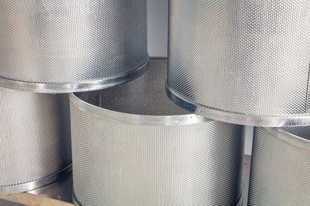A small family cheese factory in the Carpathian village. Clean metal cheese molds, for cheese dehydration.の写真素材