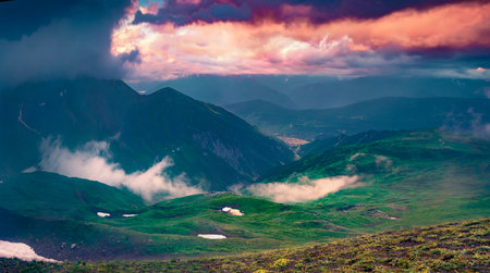 Dramatic morning view of Koruldi lake location. Amazing summer sunrise in Caucasus Mountains. Gloomy...