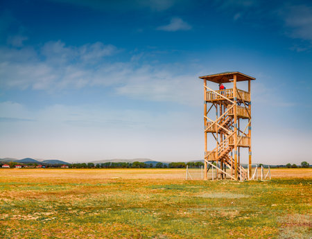 Photographer takes picture from the watchtower on the shore of Styfe Golu salt lake. Beautiful morning scene of Turkey, Asia. Travel concept background.の写真素材