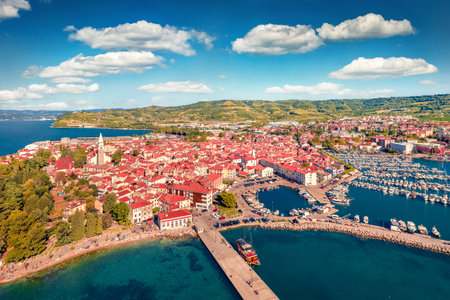 Captivating summer cityscape of Izola town, Slovenia. Superb morning seascape of the Adriatic sea. View from flying drone of old sea port. Charm of the ancient cities of Europe. Travel concept background.の写真素材