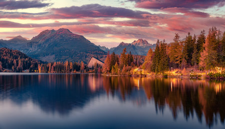 Calm autumn sunset on Strbske pleso lake. Unbelievable evening scene of High Tatras National Park, Slovakia, Europe. beauty of nature concept background.の写真素材