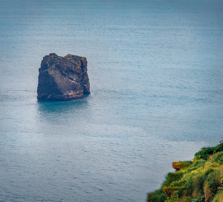 Picturesque summer scene of Huge Dyrholaey rock formation. Dyrholaey is a promontory located on the south coast of Iceland, not far from the village Vik. Beauty of nature concept background.の写真素材