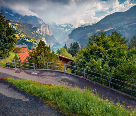 Red roof house in Wengen village. Dramatic outdoor scene of Swiss Alps, Bernese Oberland in the canton of Bern, Switzerland, Europe. Travel concept background.の写真素材
