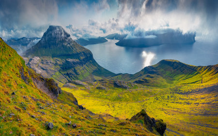 Aerial summer view of popular tourist destination - Sornfelli cliff. Amazing morning scene of Streymoy island. Astonishing seascape of Atlantic ocean, Faroe Islands, Denmark, Europe.の写真素材